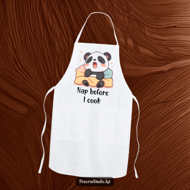 Funny apron featuring a sleepy panda yawning amidst pillows and blankets, bringing cozy humor to kitchen activities.