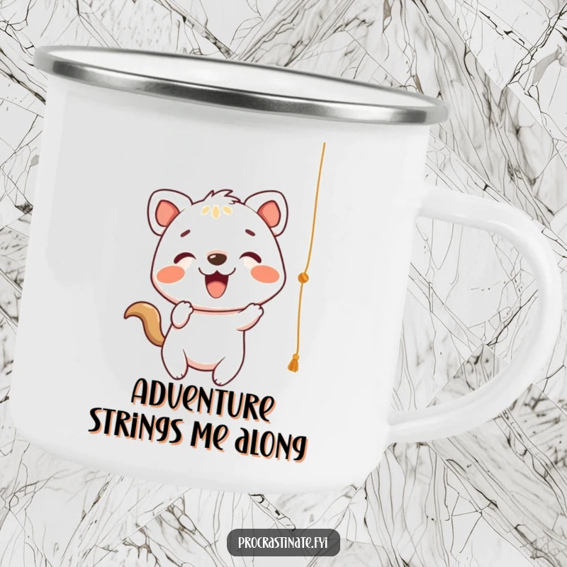 Funny Camping Mug with a cheerful animal character playfully batting at a dangling string, perfect for energetic outdoor sipping.