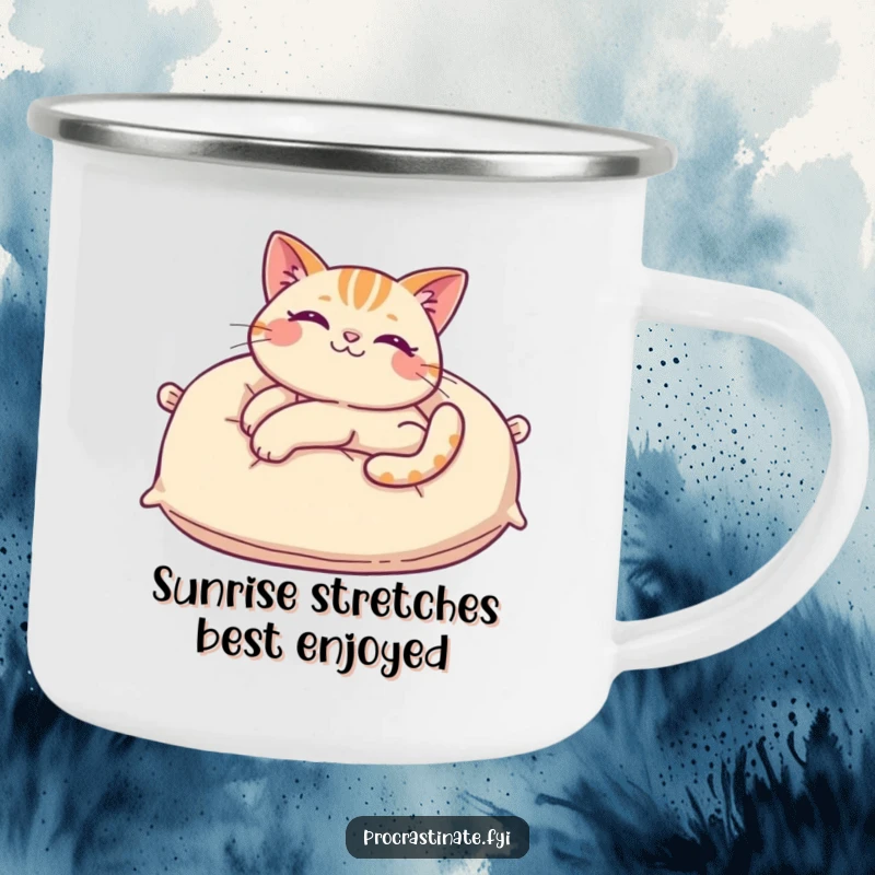 Funny cat camping mug showing a cheerful cat stretching on a giant pillow, ideal for enjoying beverages by the campfire with a humorous touch.