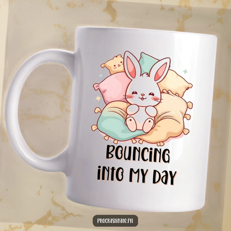 Funny playful bunny mug featuring a cute bunny surrounded by bouncing blankets and pillows. Pure joy and energy.