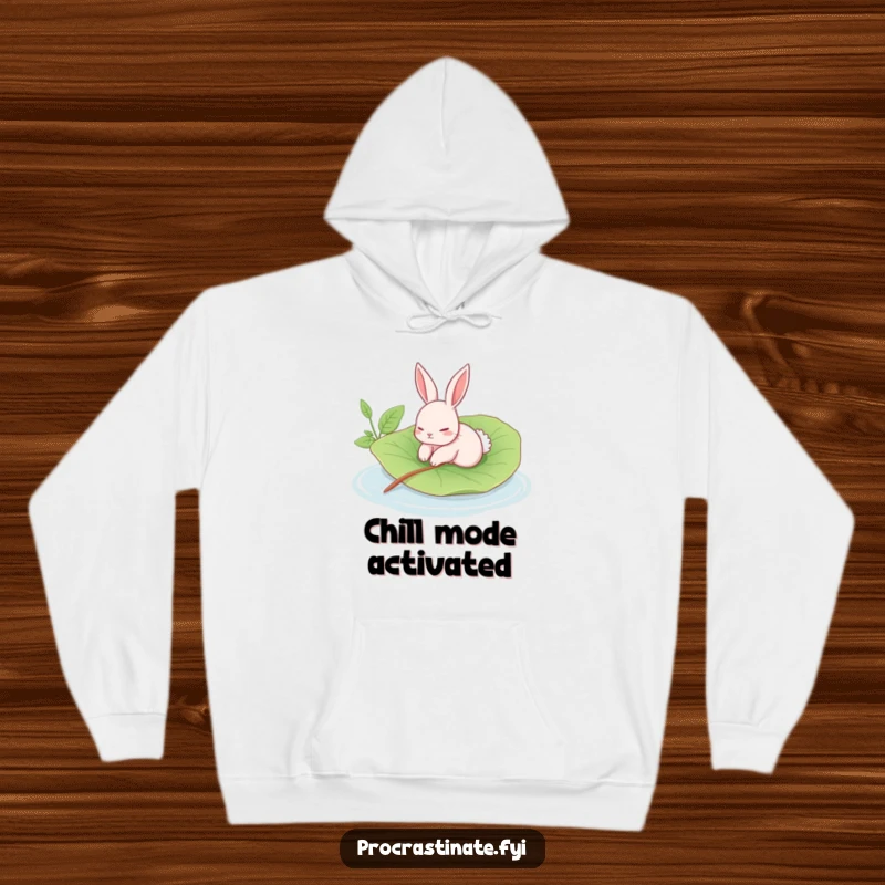 Funny rabbit hoodie showing a languid rabbit floating on a giant leaf in a calm pool, a warm and humorous garment.