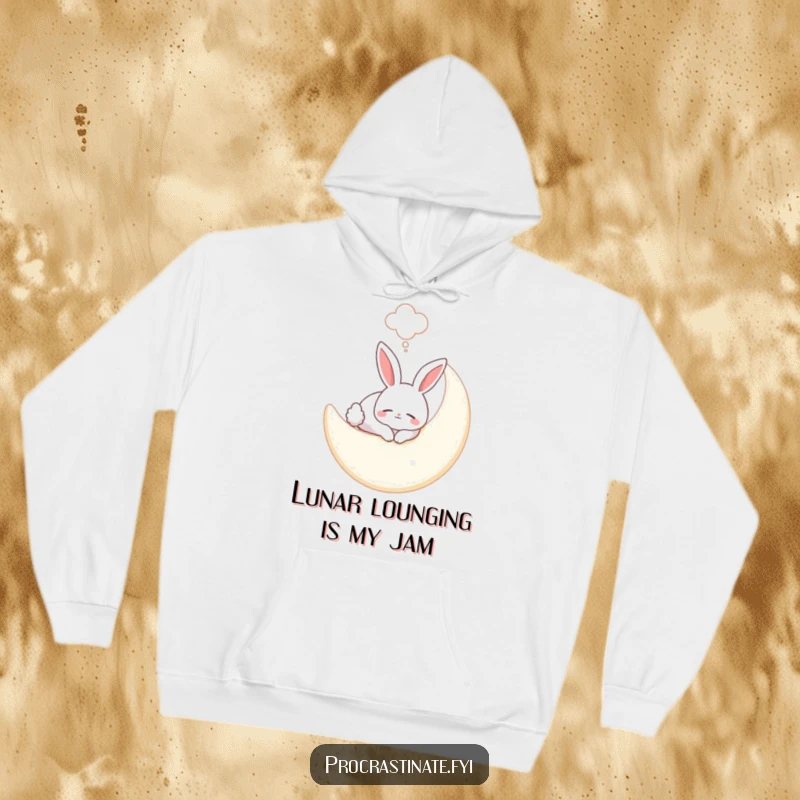 Funny bunny hoodie depicting a smiling bunny sleeping soundly on a plush moon, with a dream bubble accentuating its peaceful slumber.