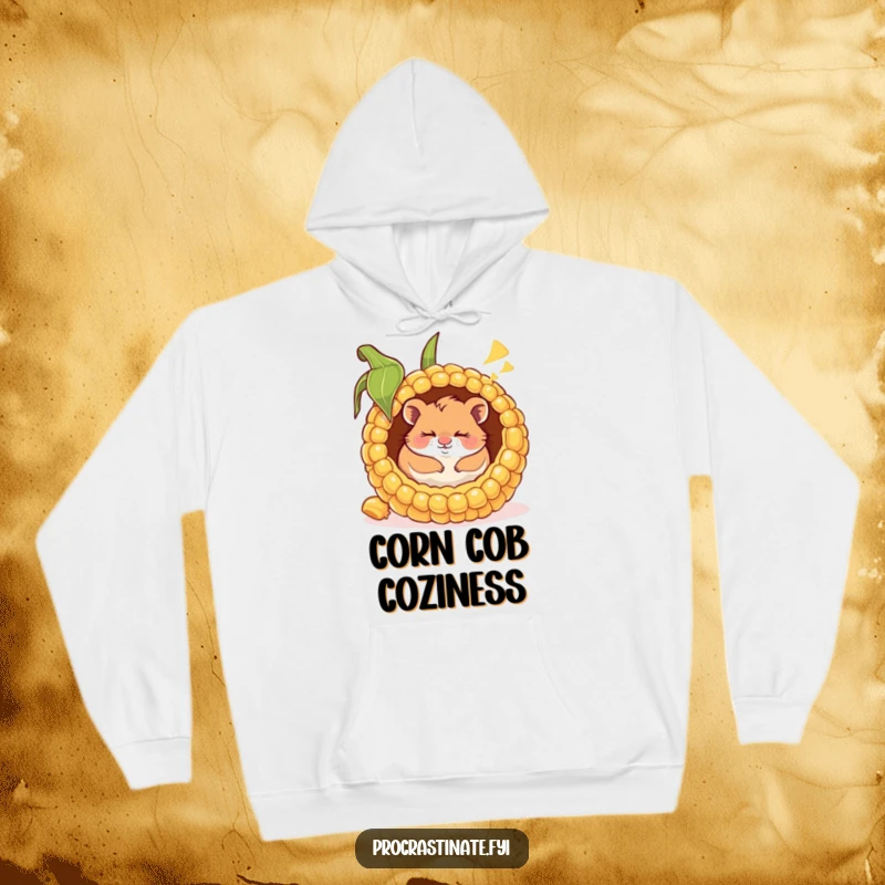 Funny hoodie depicting a happy hamster blissfully napping inside a giant corn cob, dreaming with a heartwarming smile.