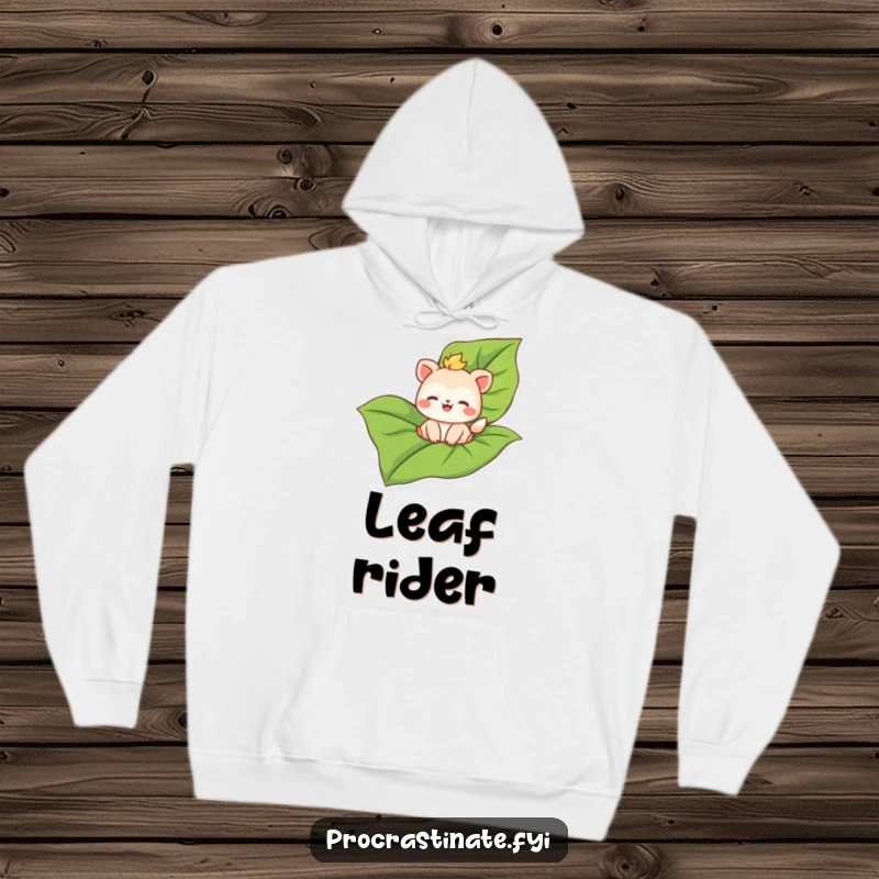Funny hoodie depicting a joyful animal character serenely floating on a vast leaf, a symbol of peaceful exploration.
