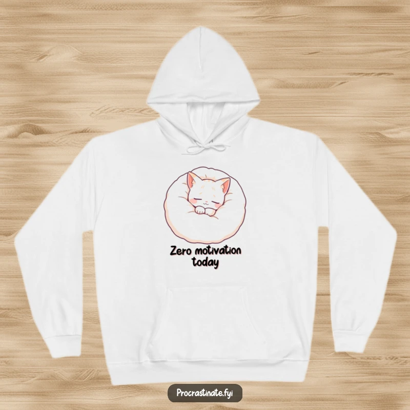 Funny cat hoodie featuring a serene cat nestled cozily inside a giant fluffy pillow, symbolizing warmth, comfort, and peaceful slumber.