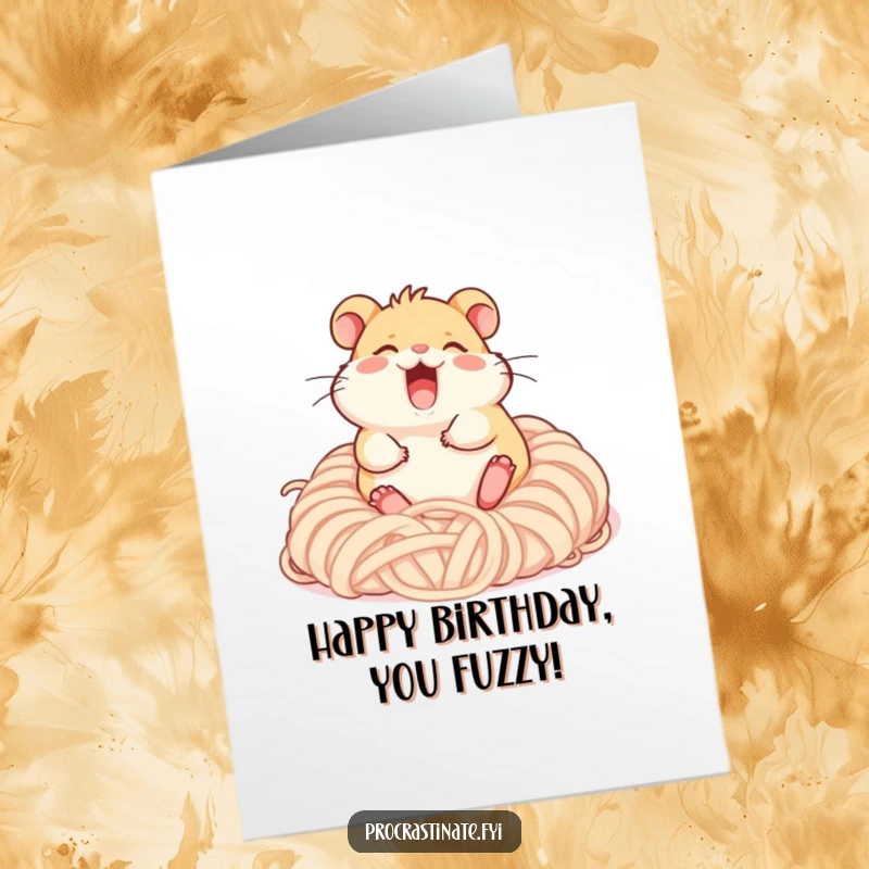 Funny free printable birthday card: a gleeful hamster character giggling while rolling in a fluffy yarn pile.