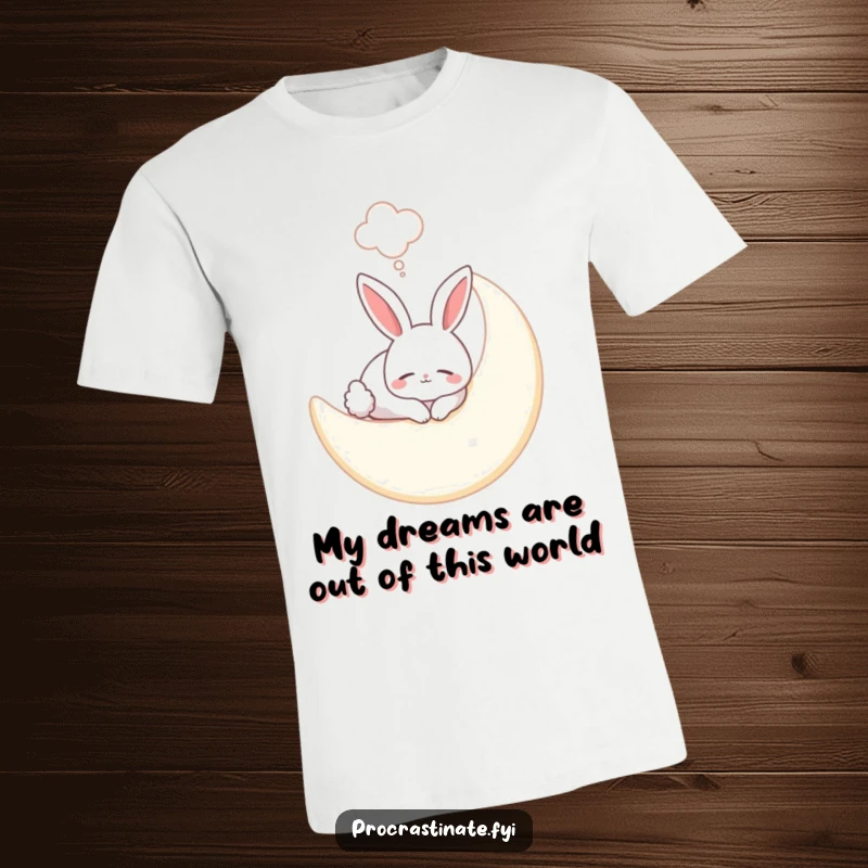 Funny bunny t-shirt showing a smiling bunny asleep on a soft moon, with a whimsical dream bubble floating above its head.