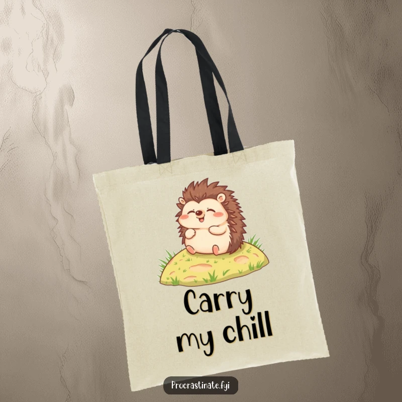 Funny tote bag showcasing a joyful hedgehog rolling relaxed down a small grassy hill, perfect for carrying items.