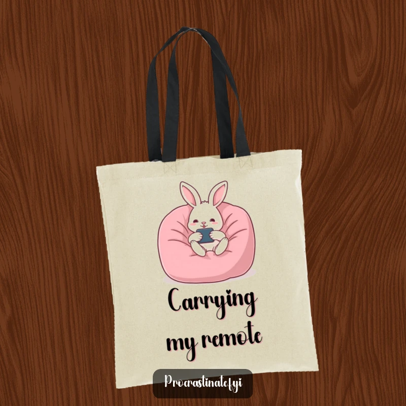 Funny rabbit tote bag featuring a relaxed rabbit lounging in a beanbag chair with a remote, ready for a day of leisure.